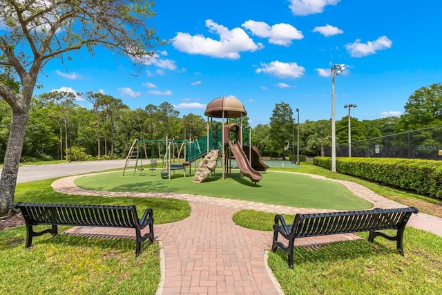 community playground featuring a yard