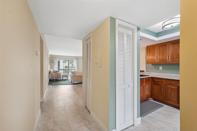 143 Lakeside Dr Unit 143, Oldsmar, FL 34677 - hall with baseboards and light marble finish floors