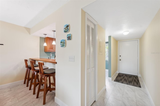 143 Lakeside Dr Unit 143, Oldsmar, FL 34677 - corridor featuring baseboards