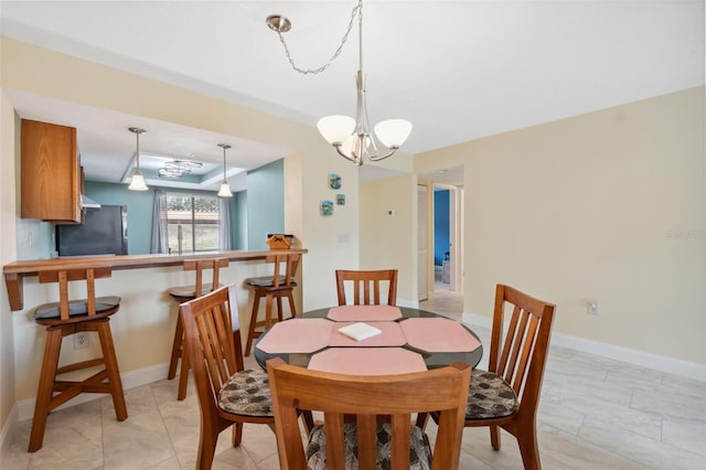 143 Lakeside Dr Unit 143, Oldsmar, FL 34677 - dining room featuring baseboards and a chandelier