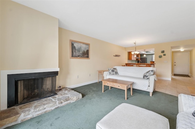 143 Lakeside Dr Unit 143, Oldsmar, FL 34677 - living room featuring carpet flooring, a fireplace, and baseboards