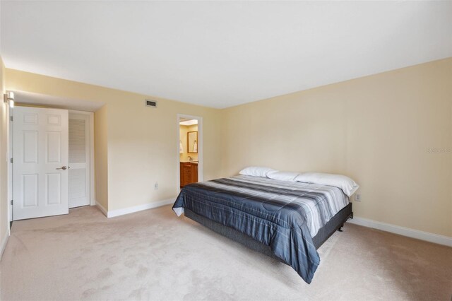 143 Lakeside Dr Unit 143, Oldsmar, FL 34677 - bedroom with light carpet and baseboards