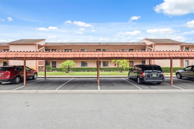 143 Lakeside Dr Unit 143, Oldsmar, FL 34677 - view of building exterior featuring covered parking