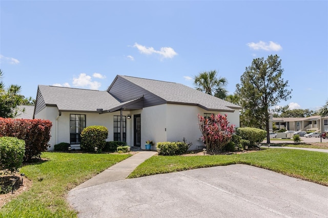 322 Windrush Loop Unit 22, Tarpon Springs, FL 34689 - single story home with a front yard and stucco siding