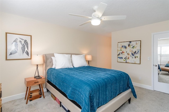 322 Windrush Loop Unit 22, Tarpon Springs, FL 34689 - carpeted bedroom featuring a ceiling fan and baseboards