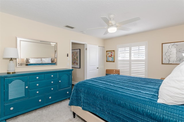 322 Windrush Loop Unit 22, Tarpon Springs, FL 34689 - bedroom featuring light carpet and a ceiling fan