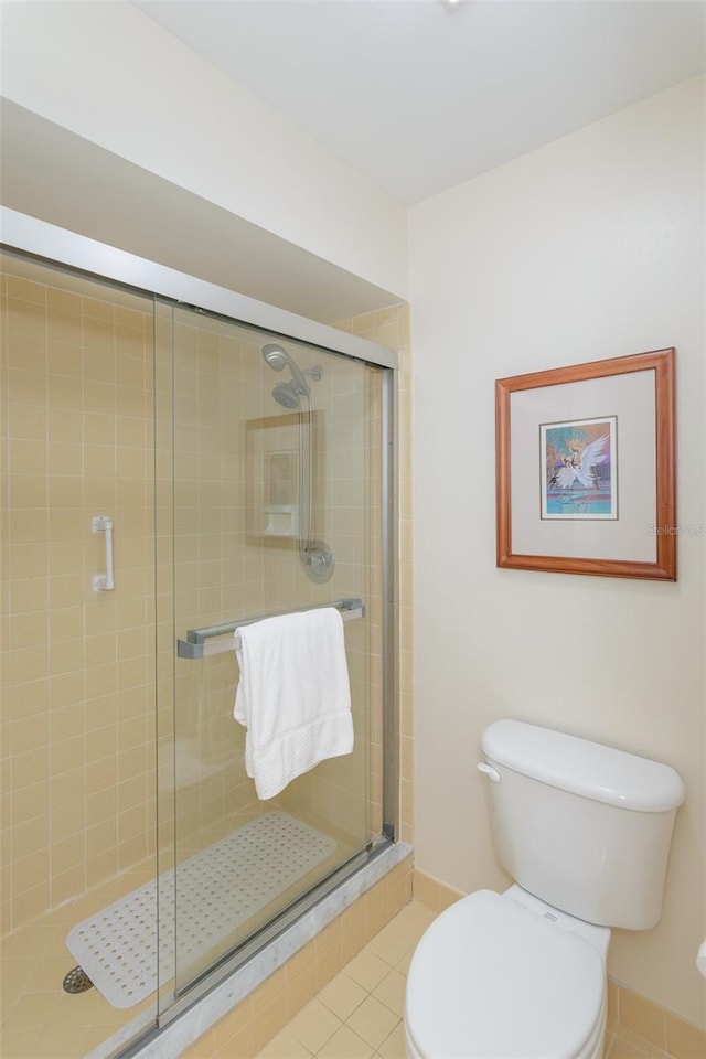 322 Windrush Loop Unit 22, Tarpon Springs, FL 34689 - full bathroom with toilet, a shower stall, and tile patterned flooring