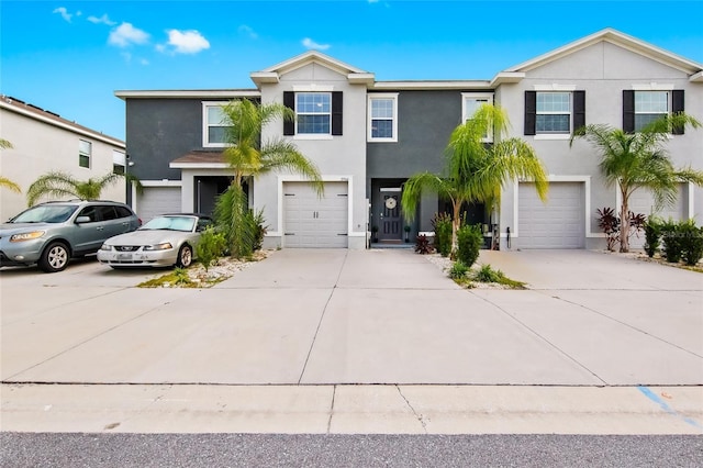 2906 Boxwood Grove Row, Wesley Chapel, FL 33543 - view of front of property featuring a garage, stucco siding, and concrete driveway