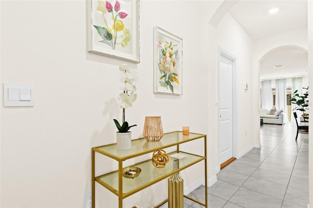 2906 Boxwood Grove Row, Wesley Chapel, FL 33543 - corridor with arched walkways, light tile patterned floors, and baseboards