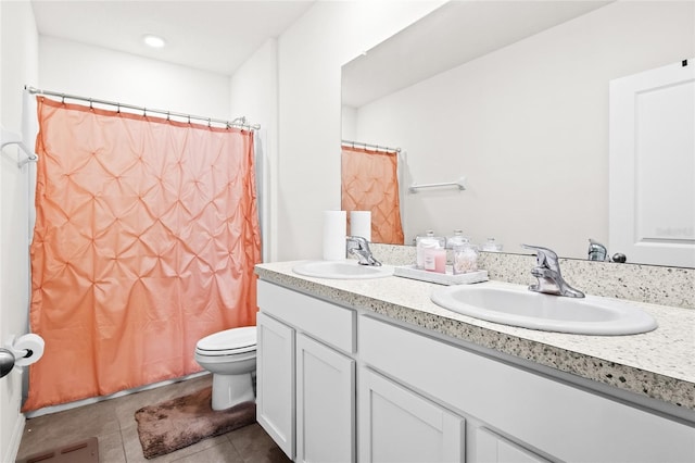 2906 Boxwood Grove Row, Wesley Chapel, FL 33543 - bathroom featuring tile patterned flooring, toilet, double vanity, and a shower with curtain
