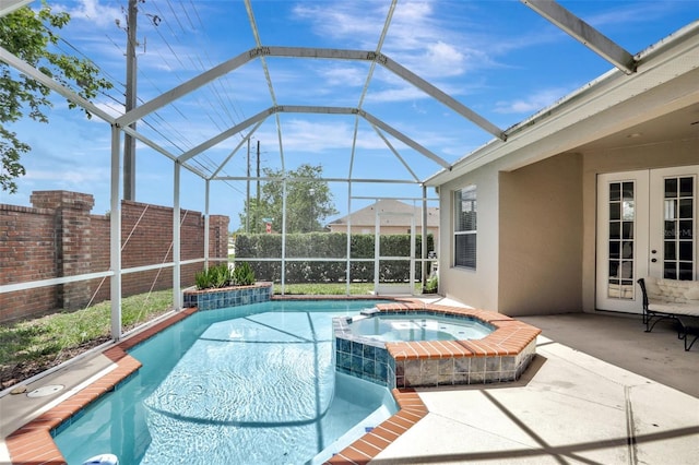 13708 Old Dock Rd, Orlando, FL 32828 - view of pool featuring french doors, a patio area, a fenced backyard, a pool with connected hot tub, and glass enclosure