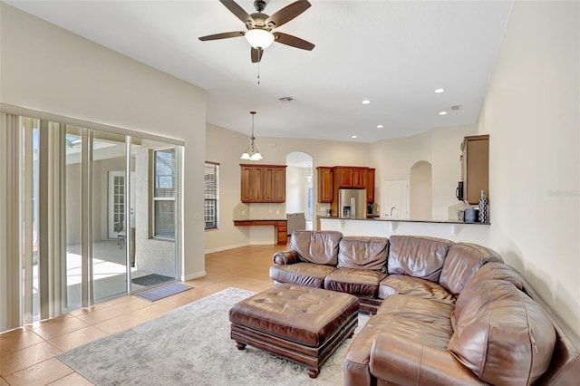 13708 Old Dock Rd, Orlando, FL 32828 - living area featuring arched walkways, a ceiling fan, recessed lighting, and light tile patterned flooring