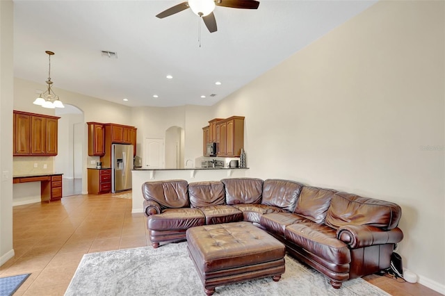 13708 Old Dock Rd, Orlando, FL 32828 - living room featuring arched walkways, light tile patterned floors, ceiling fan, baseboards, and recessed lighting