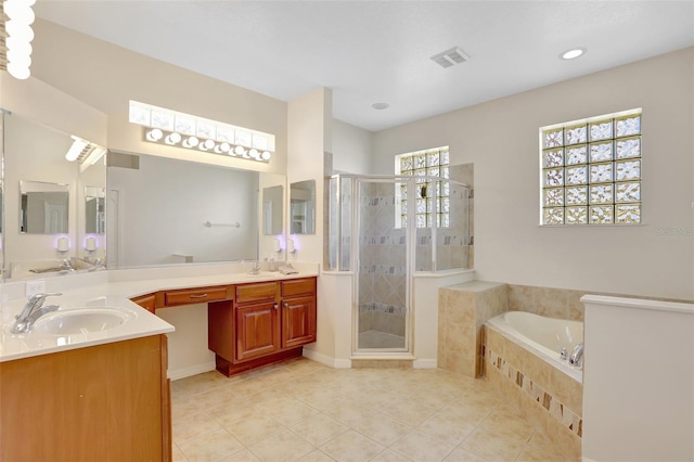 13708 Old Dock Rd, Orlando, FL 32828 - bathroom with a garden tub, a stall shower, tile patterned floors, double vanity, and recessed lighting