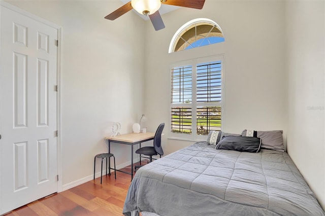 13708 Old Dock Rd, Orlando, FL 32828 - bedroom featuring wood finished floors, baseboards, and a ceiling fan
