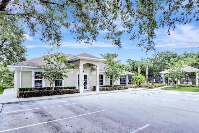 13708 Old Dock Rd, Orlando, FL 32828 - view of building exterior featuring fence and uncovered parking