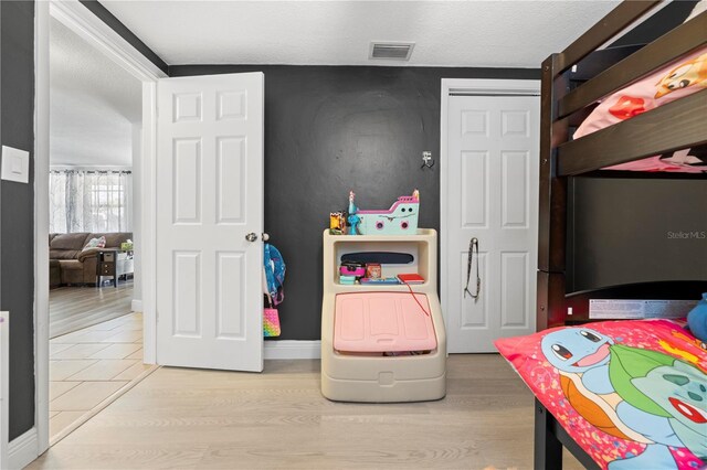 9126 Greenbriar Ln, Port Richey, FL 34668 - bedroom with light wood-type flooring