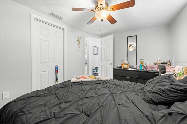 9126 Greenbriar Ln, Port Richey, FL 34668 - bedroom featuring a closet and ceiling fan