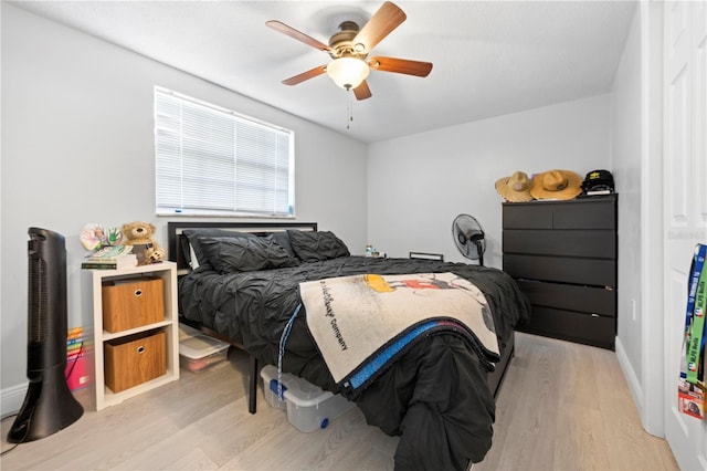 9126 Greenbriar Ln, Port Richey, FL 34668 - bedroom with light wood finished floors and a ceiling fan