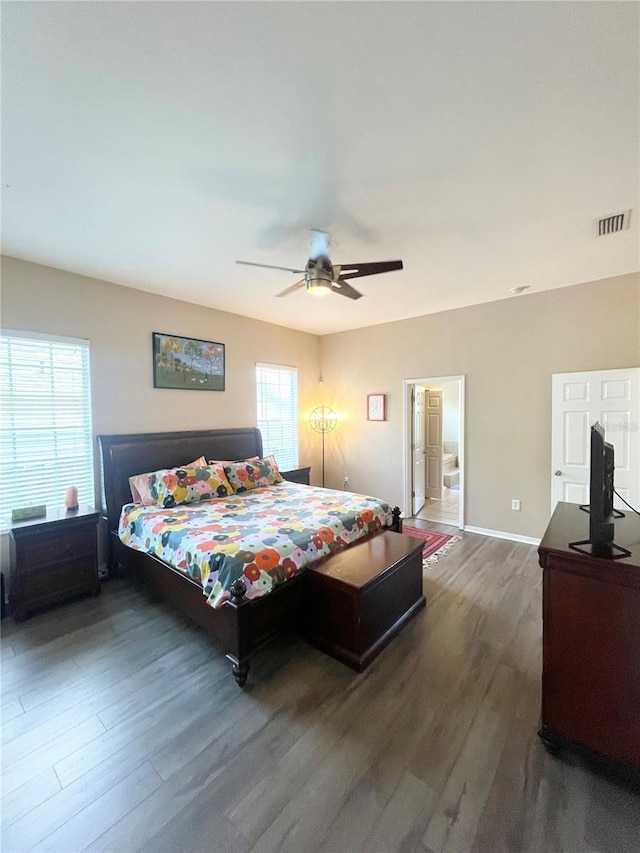 2244 NW 101st St, Gainesville, FL 32606 - bedroom with wood finished floors, a ceiling fan, and baseboards