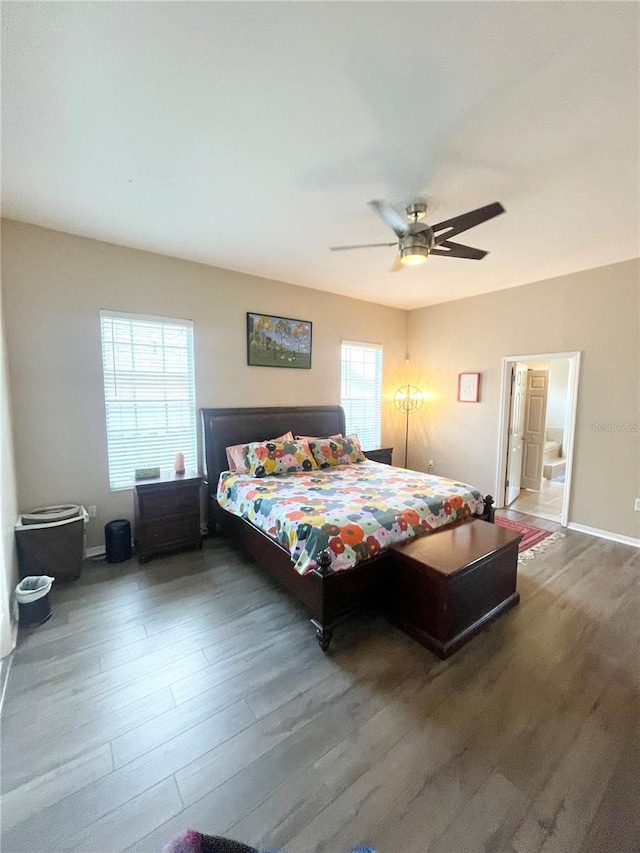 2244 NW 101st St, Gainesville, FL 32606 - bedroom featuring wood finished floors, a ceiling fan, and baseboards