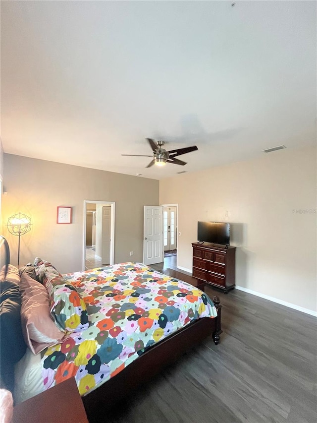 2244 NW 101st St, Gainesville, FL 32606 - bedroom featuring wood finished floors, baseboards, and ceiling fan