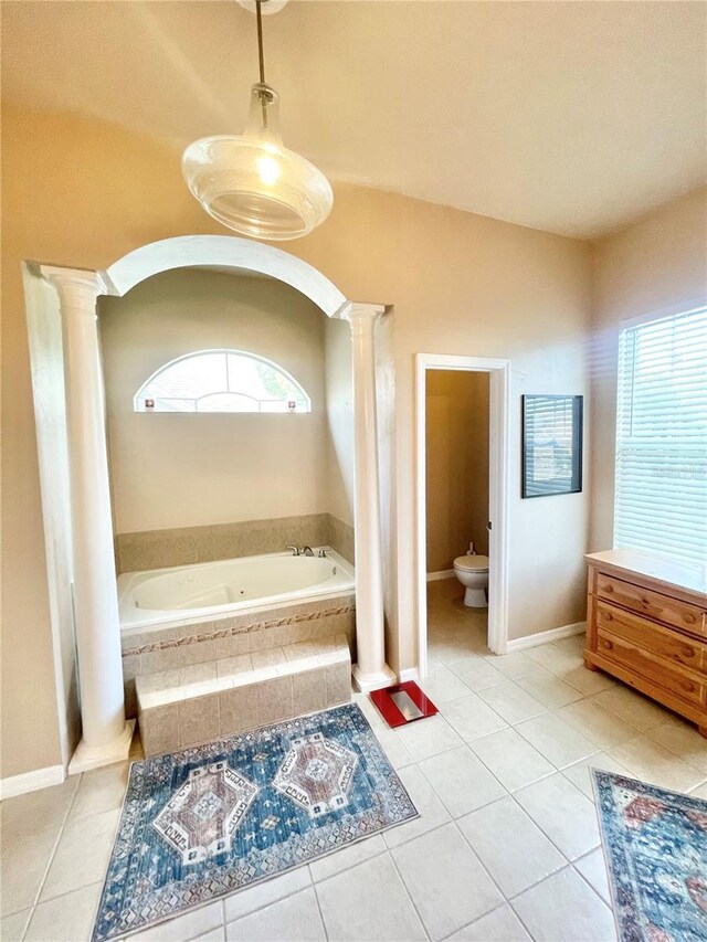 2244 NW 101st St, Gainesville, FL 32606 - bathroom featuring ornate columns, tile patterned floors, and a bath