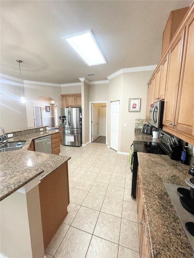 2244 NW 101st St, Gainesville, FL 32606 - kitchen with a sink, stainless steel appliances, arched walkways, ornamental molding, and baseboards