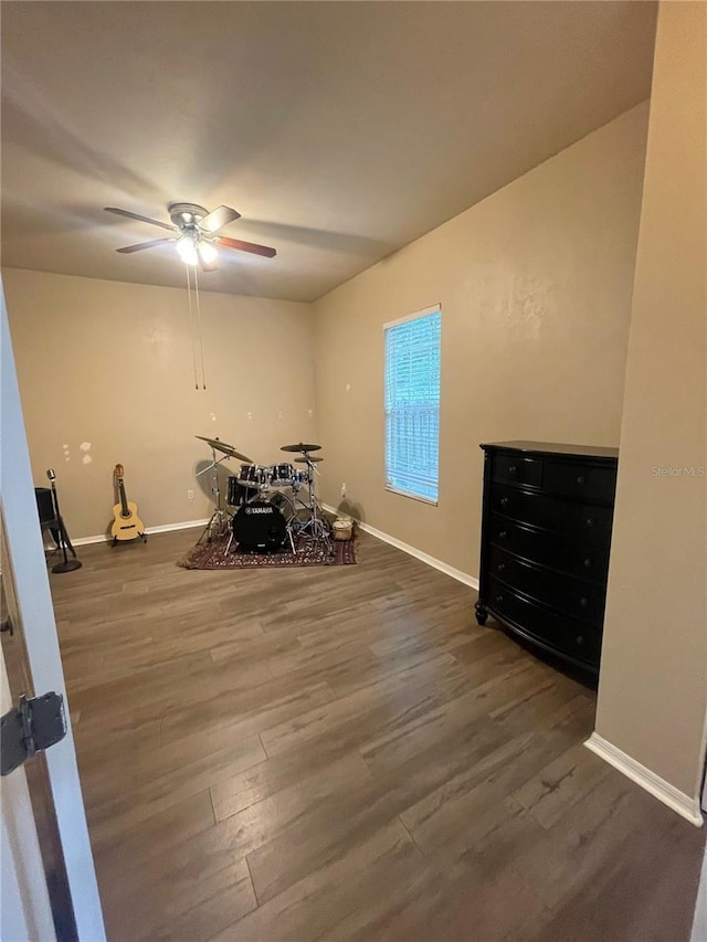 2244 NW 101st St, Gainesville, FL 32606 - misc room with wood finished floors, a ceiling fan, and baseboards
