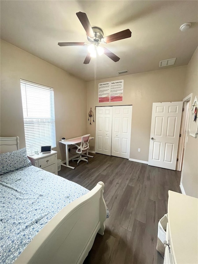 2244 NW 101st St, Gainesville, FL 32606 - bedroom featuring dark wood finished floors, a closet, baseboards, and a ceiling fan