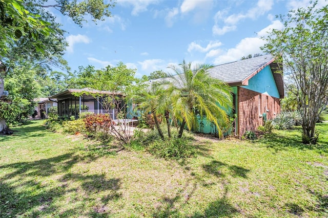 3224 Hilary Cir, Palm Harbor, FL 34684 - view of green lawn featuring a sunroom