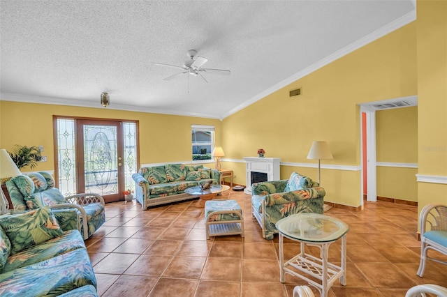 3224 Hilary Cir, Palm Harbor, FL 34684 - living area featuring lofted ceiling, ceiling fan, a fireplace, tile patterned floors, and crown molding