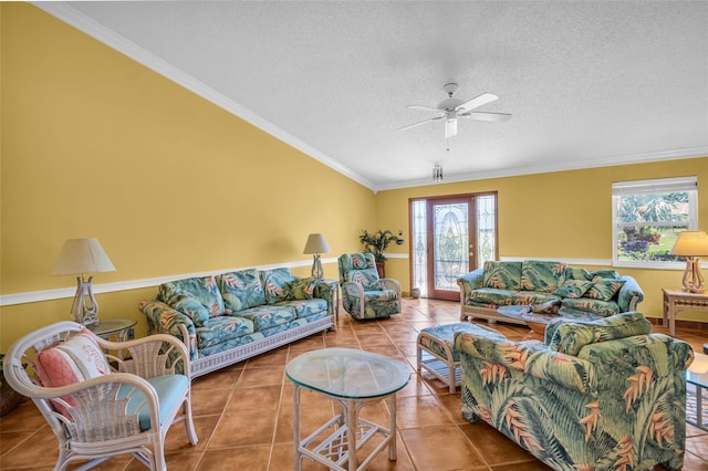 3224 Hilary Cir, Palm Harbor, FL 34684 - tiled living room featuring plenty of natural light, a ceiling fan, a textured ceiling, and crown molding