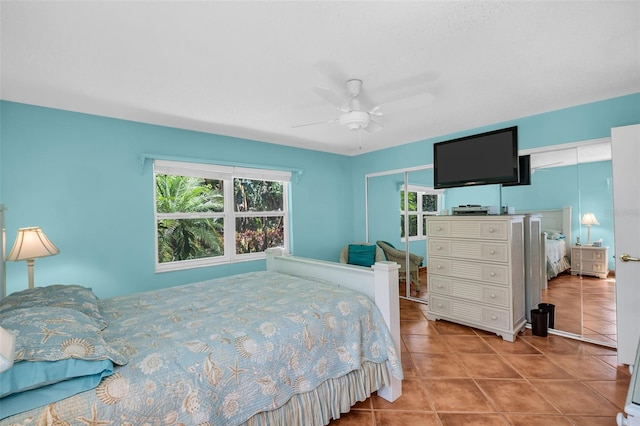 3224 Hilary Cir, Palm Harbor, FL 34684 - bedroom featuring tile patterned floors, multiple windows, and a ceiling fan