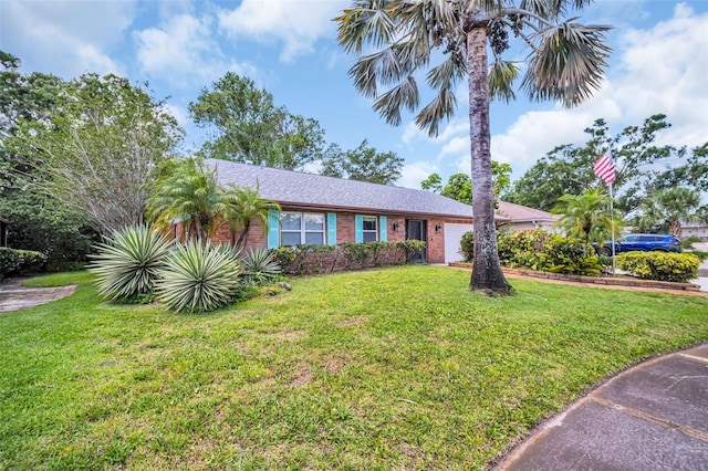 3224 Hilary Cir, Palm Harbor, FL 34684 - ranch-style home with a garage, a front lawn, and brick siding
