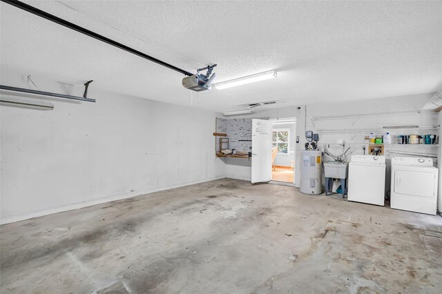 3224 Hilary Cir, Palm Harbor, FL 34684 - garage featuring washer and dryer, water heater, and a garage door opener
