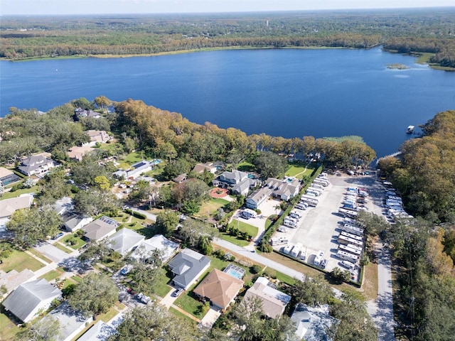 3224 Hilary Cir, Palm Harbor, FL 34684 - aerial view of property and surrounding area featuring a forest, a nearby body of water, and nearby suburban area