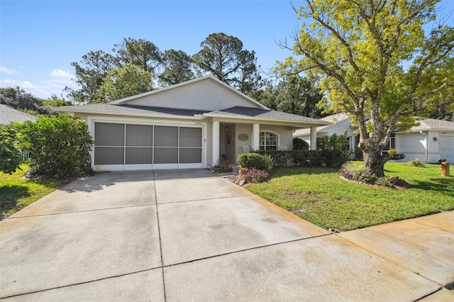 11446 Sinatra Ct, New Port Richey, FL 34654 - view of front of property featuring driveway, stucco siding, a front lawn, and an attached garage