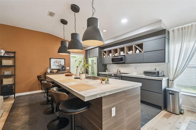 11446 Sinatra Ct, New Port Richey, FL 34654 - kitchen featuring gray cabinets, stainless steel appliances, light countertops, modern cabinets, and recessed lighting