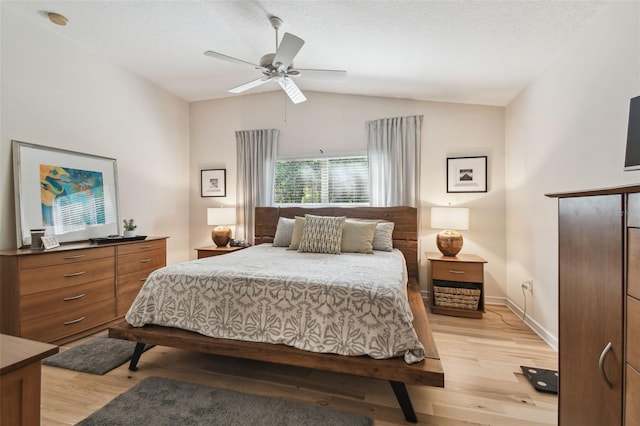 11446 Sinatra Ct, New Port Richey, FL 34654 - bedroom featuring vaulted ceiling, light wood-style flooring, ceiling fan, and baseboards