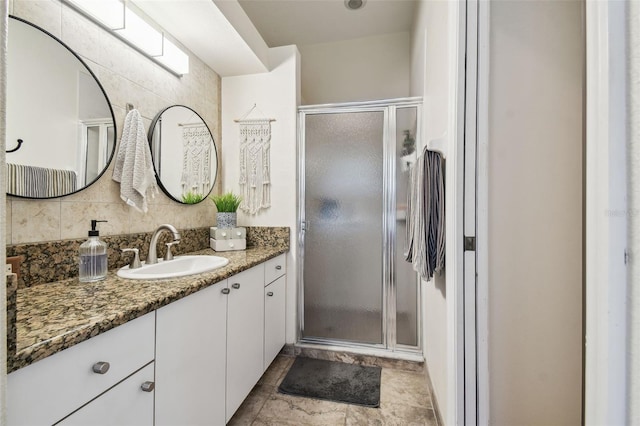 11446 Sinatra Ct, New Port Richey, FL 34654 - full bathroom with vanity, a stall shower, and backsplash