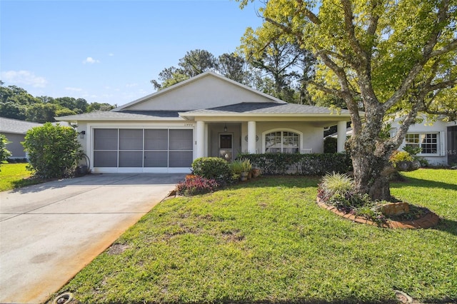 11446 Sinatra Ct, New Port Richey, FL 34654 - view of front of house with stucco siding, a garage, driveway, and a front yard