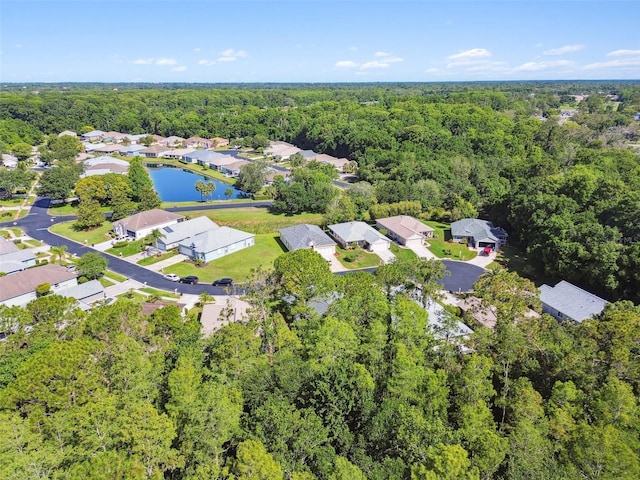11446 Sinatra Ct, New Port Richey, FL 34654 - aerial perspective of suburban area featuring a forest and a large body of water