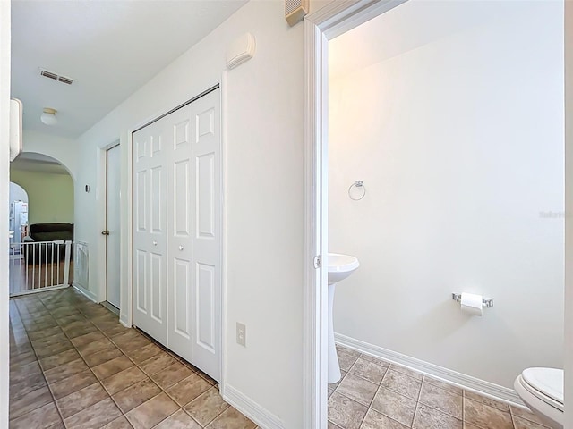 4732 Ashburn Pond Way, Tampa, FL 33610 - bathroom with toilet and tile patterned flooring