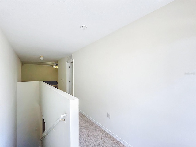 4732 Ashburn Pond Way, Tampa, FL 33610 - hallway with an upstairs landing and carpet floors