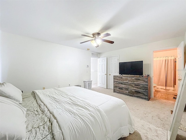 4732 Ashburn Pond Way, Tampa, FL 33610 - bedroom with carpet, ceiling fan, and ensuite bath