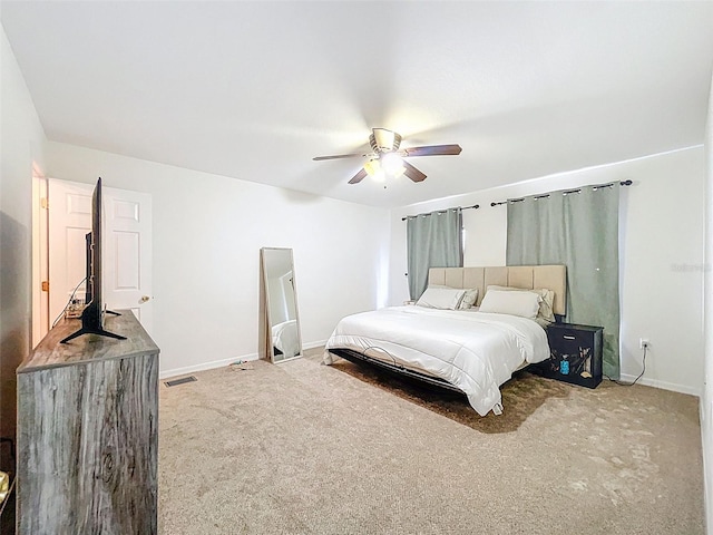 4732 Ashburn Pond Way, Tampa, FL 33610 - carpeted bedroom with baseboards and a ceiling fan