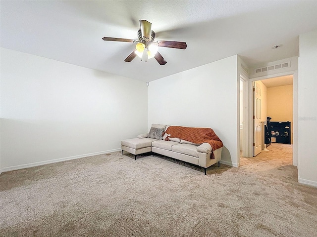 4732 Ashburn Pond Way, Tampa, FL 33610 - carpeted living area featuring ceiling fan and baseboards
