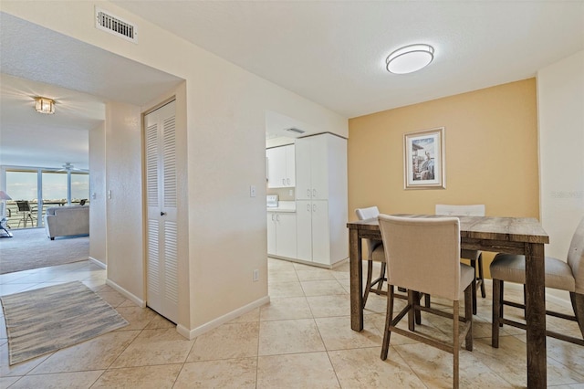 6105 Bahia Del Mar Cir Unit 683, Saint Petersburg, FL 33715 - dining space featuring light tile patterned flooring and baseboards