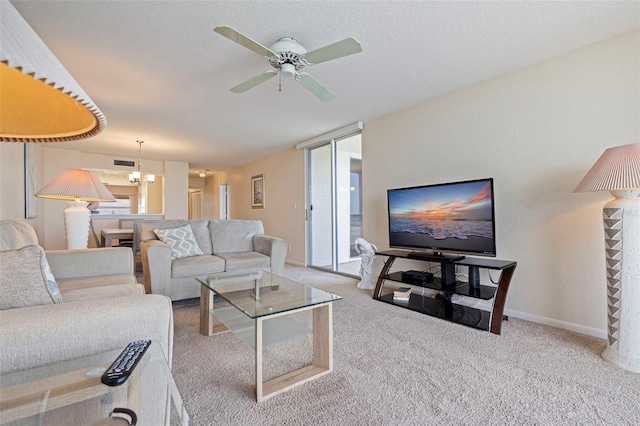6105 Bahia Del Mar Cir Unit 683, Saint Petersburg, FL 33715 - carpeted living area featuring a ceiling fan, a chandelier, and baseboards